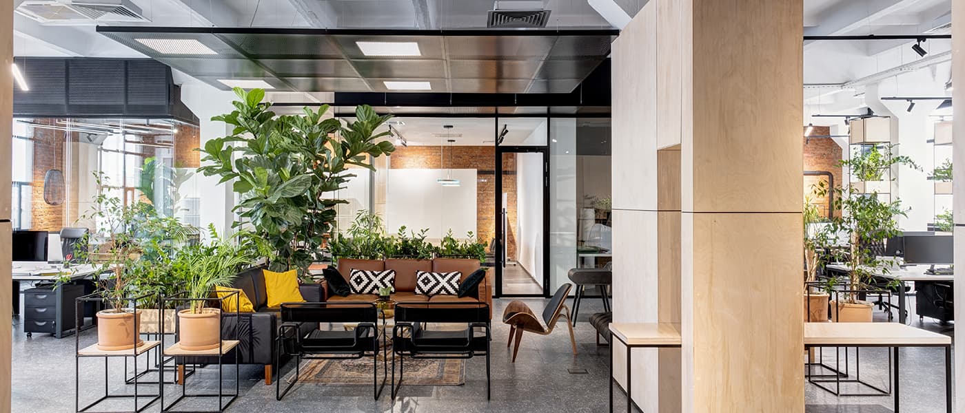 beautiful office building with comfortable seating and greenery