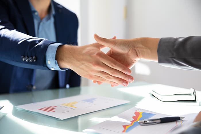 two people shaking hands