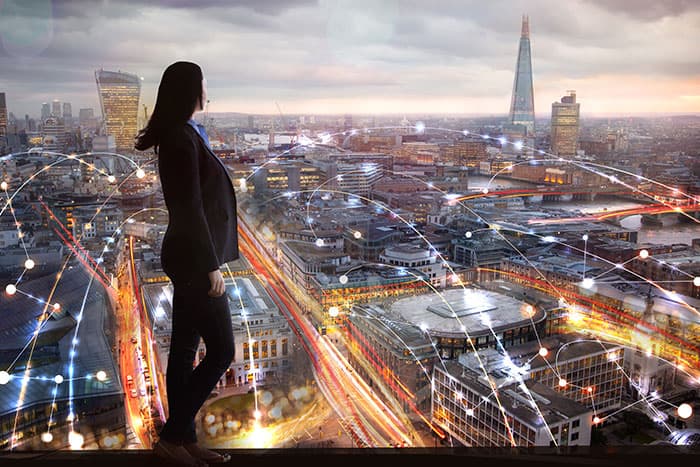 women overlooking multiple commercial properties in a city