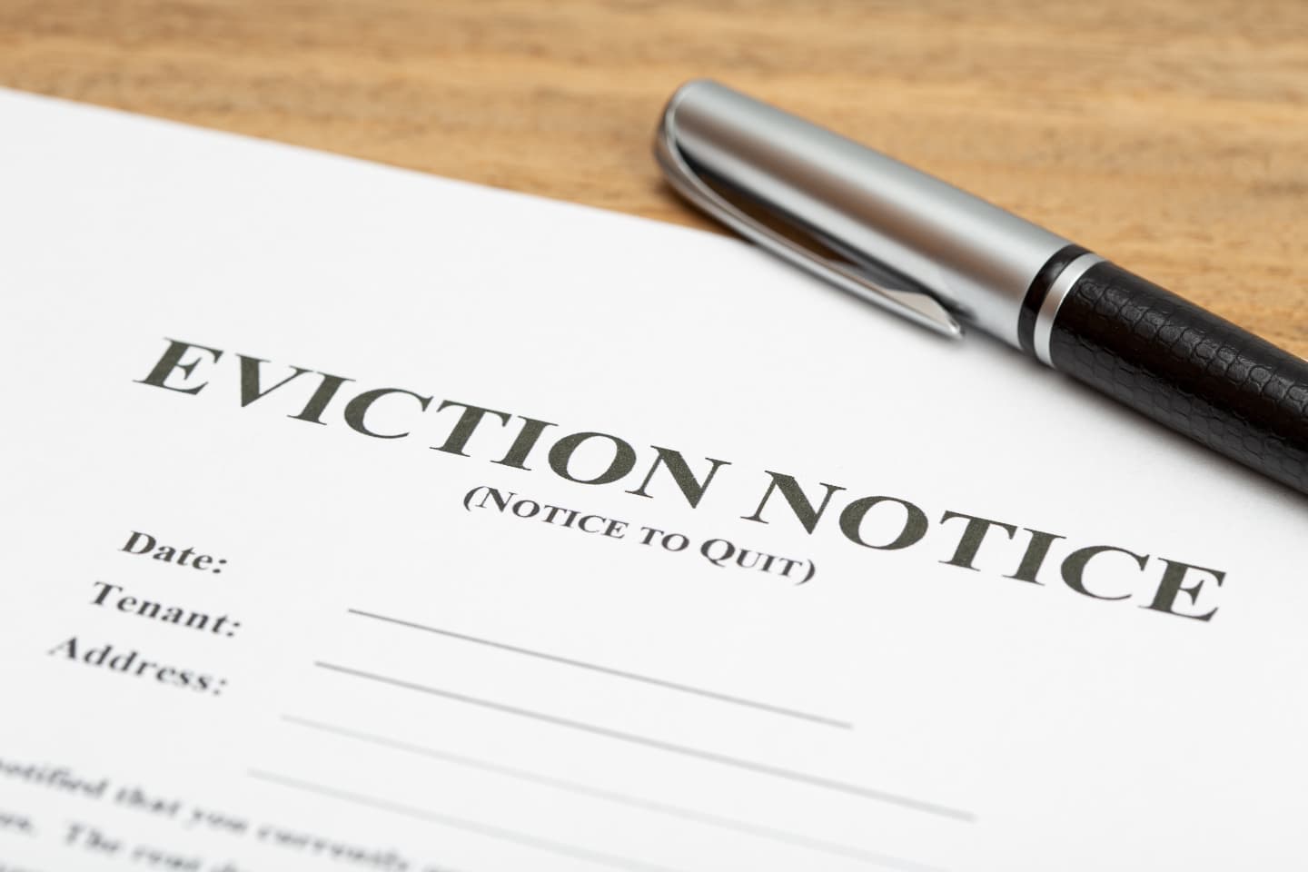 image of an eviction notice with a pen