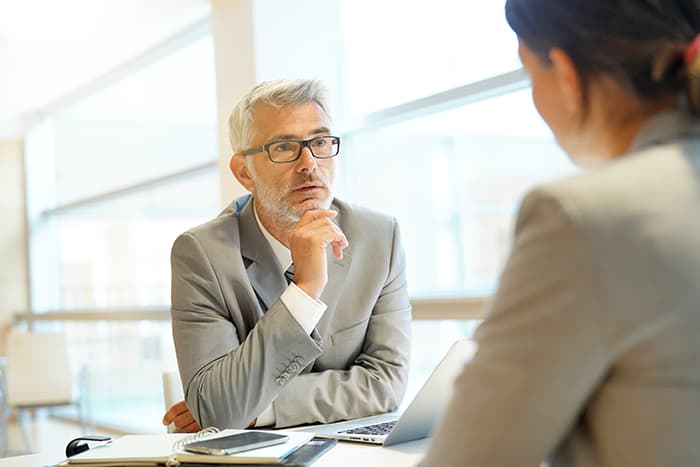A man listening attentively to a woman