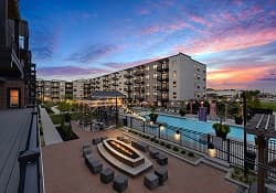 Apartment property with a pool and firepit