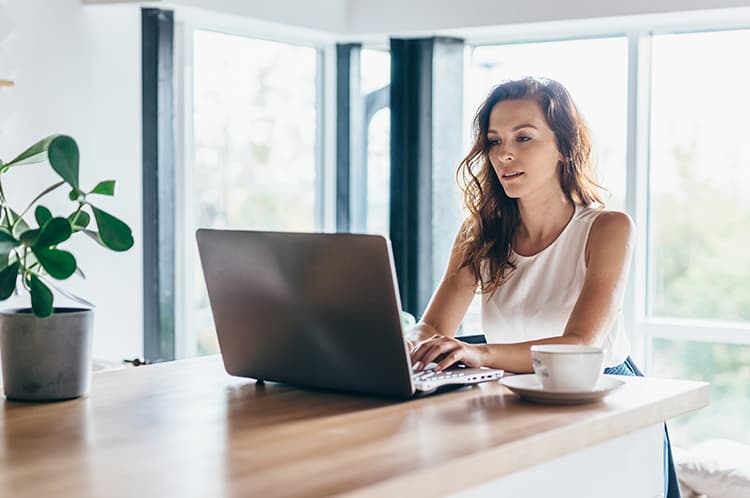 Women working on a laptop at home