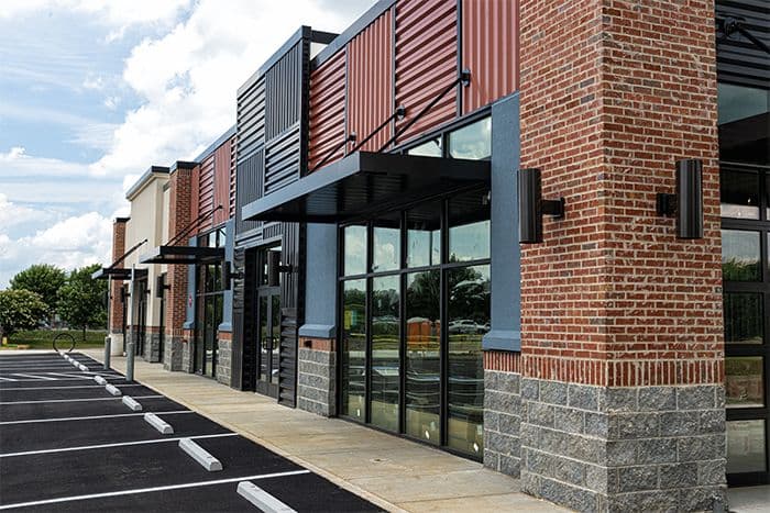 A commercial storefront with three entrances
