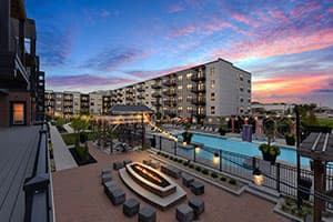 Apartment property with a pool and firepit