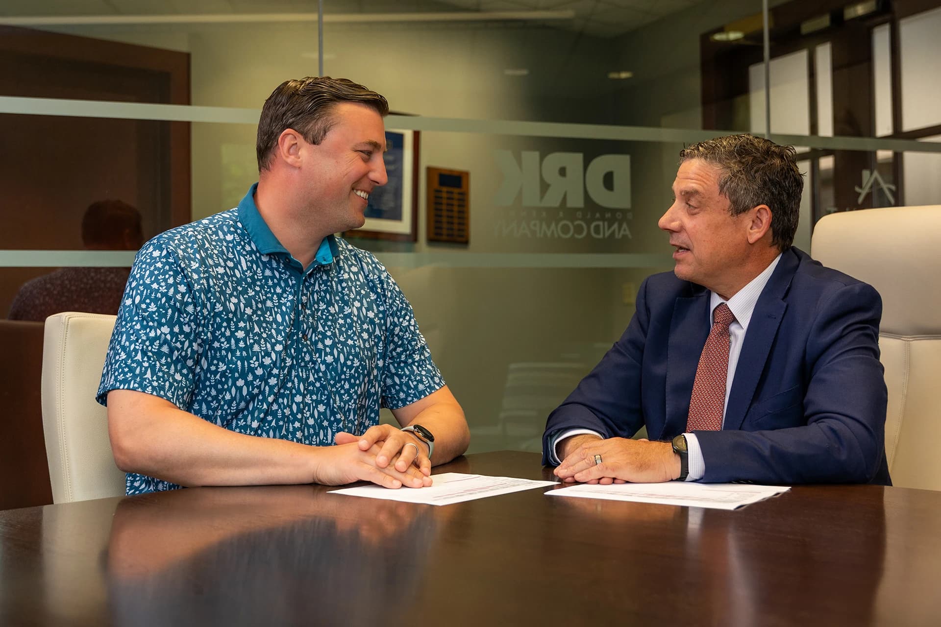 Two men discussing property management