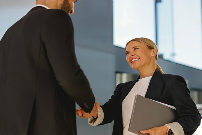 man and woman shaking hands