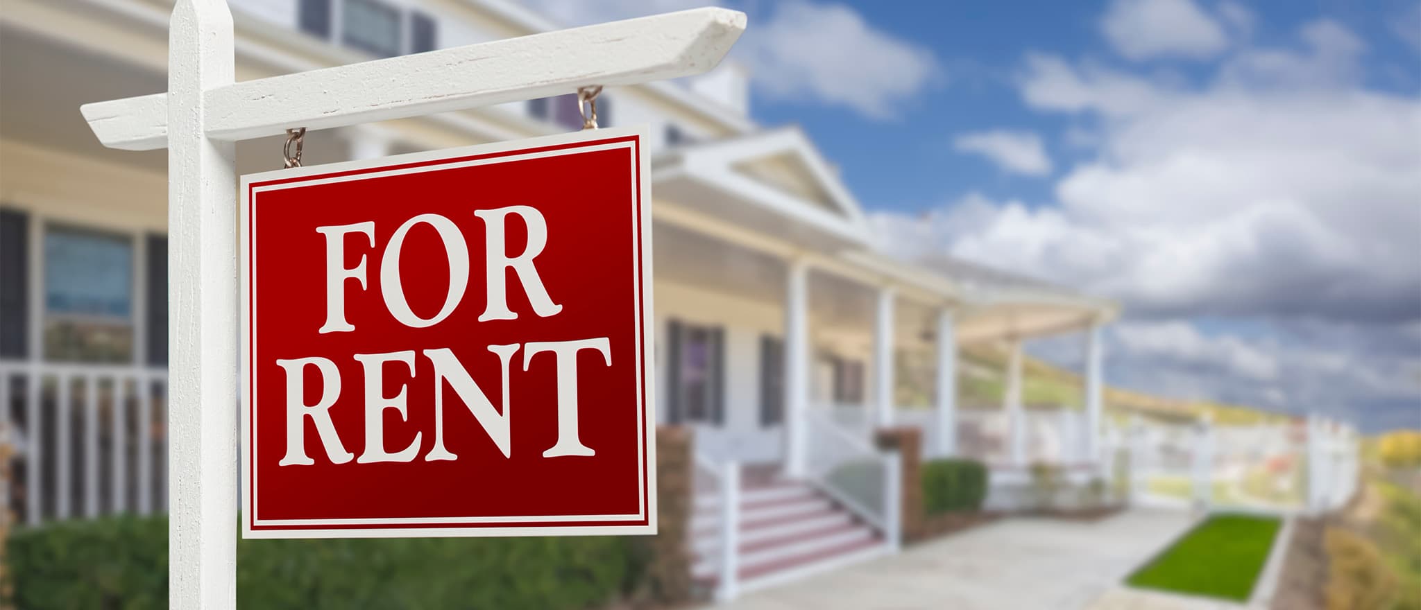A "for rent" sign outside a rental property