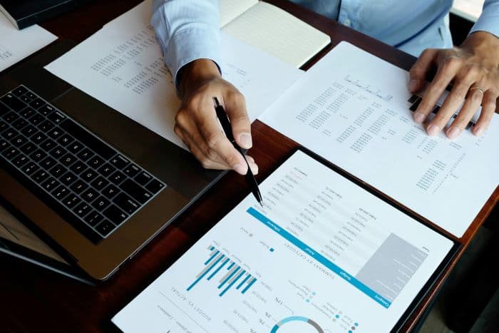 Person reviewing financials at a desk
