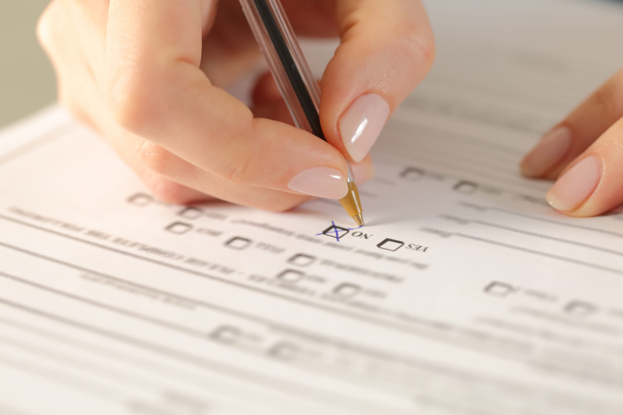 Woman hands filling form crossing no checkbox