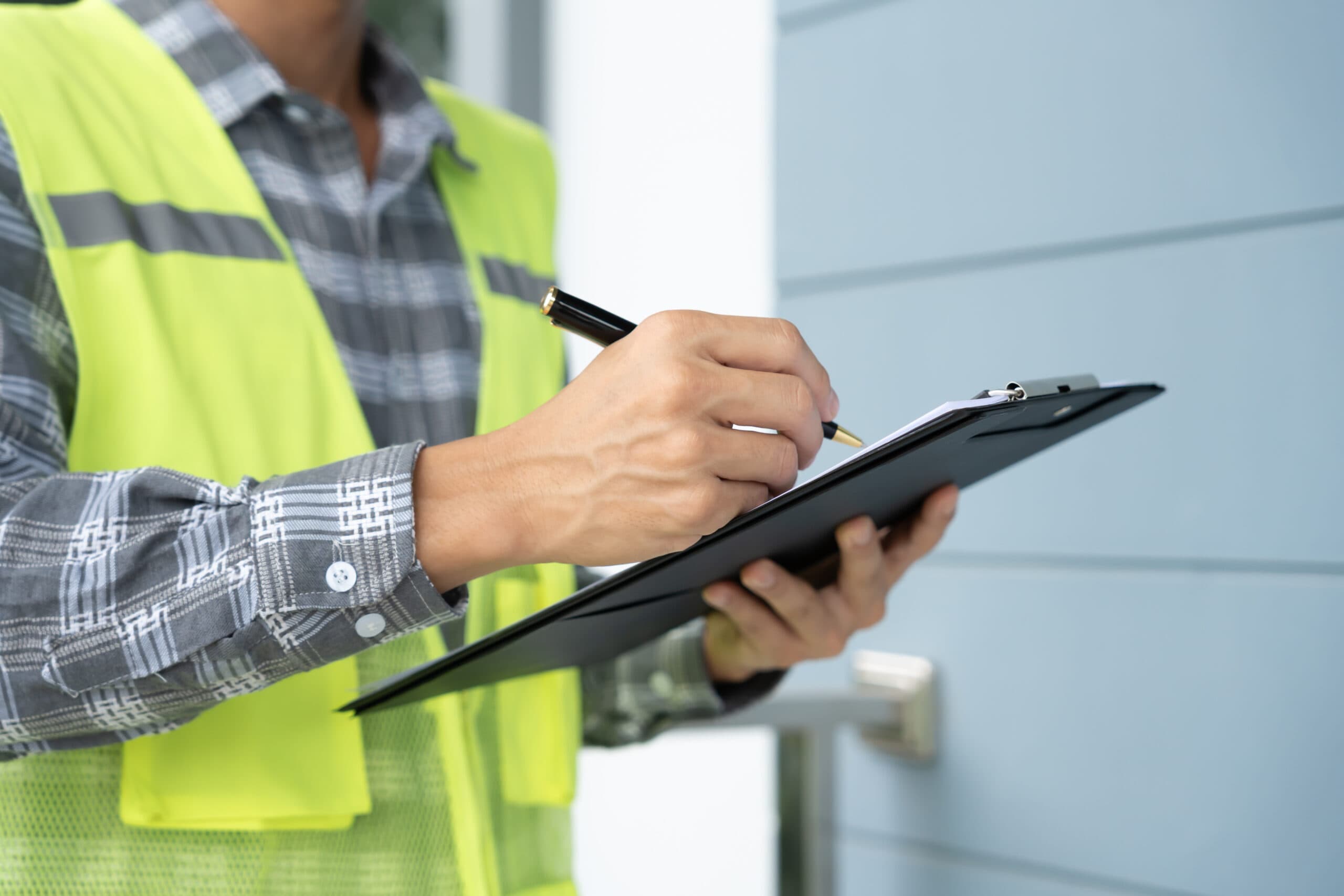 an individual performing an inspection on a building