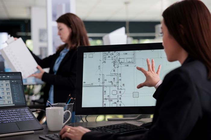 Woman working in room floor planner software