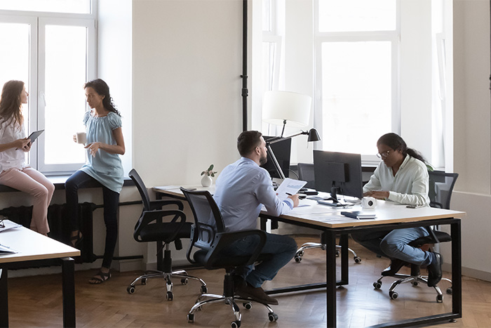 Employees working in a second floor office space.