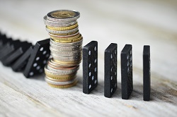 Dominos blocked by stack of change